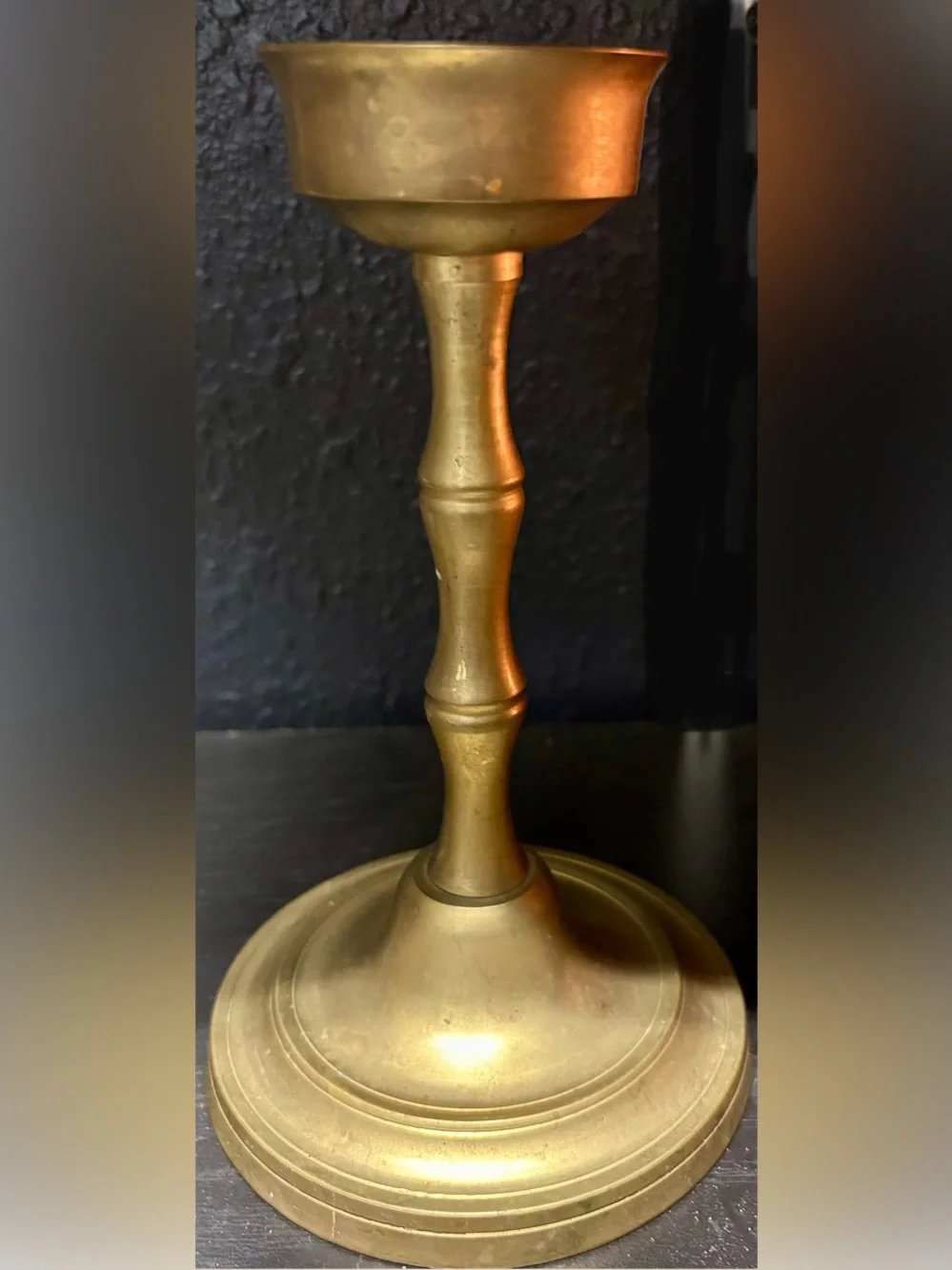 Brass Candle Holder classic baluster-style stem and a stepped round base.